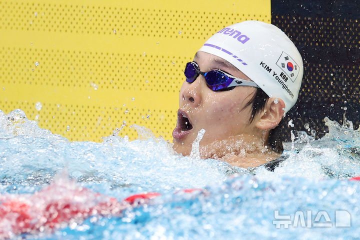 김영범, 아시안게임 자유형 50m 예선에서 신기록 수립하며 결승 진출
